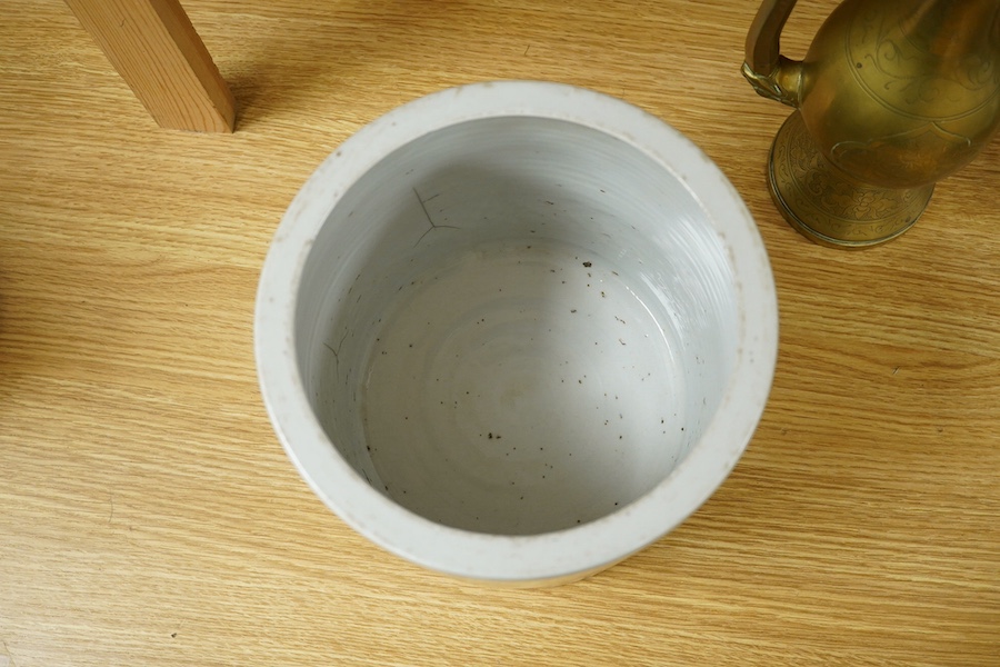 A Chinese cylindrical blue and white brush pot and a brass ewer, largest 39cm high. Condition - fair